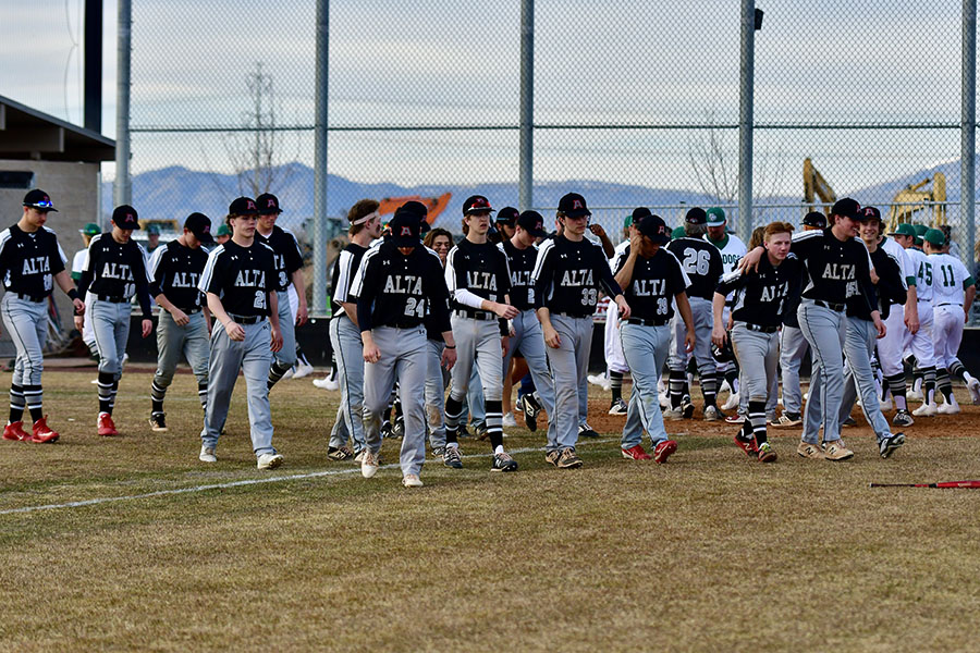 The baseball team takes the field.
