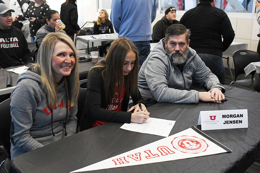 Morgan Jensen signs her letter of intent to run track for the University of Utah at this year's College Signing Day.