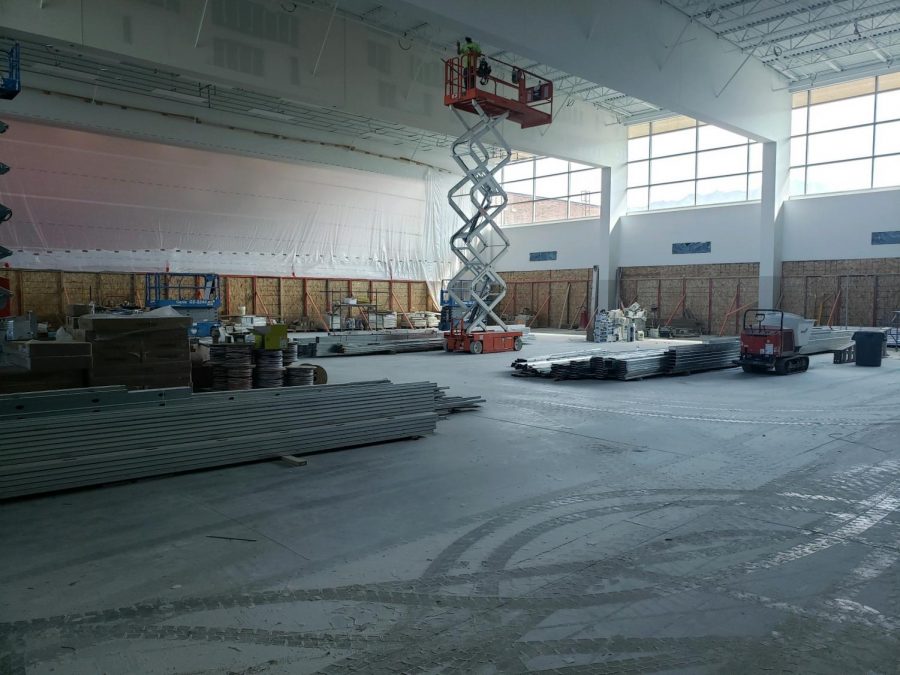 Construction crews put the finishing touches on the ceiling in the newly remodeled commons.