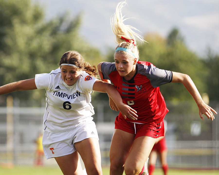 Macy Ellis fights her Timpview opponent for the ball.