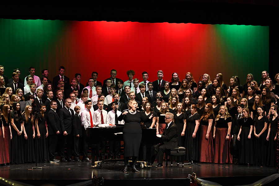 Ms. Iund leads last years choirs in a group number at the yearly holiday concert.