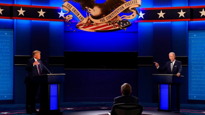 President Donald Trump, left, and Democratic presidential candidate former Vice President Joe Biden, right, with moderator Chris Wallace, center, of Fox News during the first presidential debate Tuesday, Sept. 29, 2020, at Case Western University and Cleveland Clinic, in Cleveland, Ohio. 