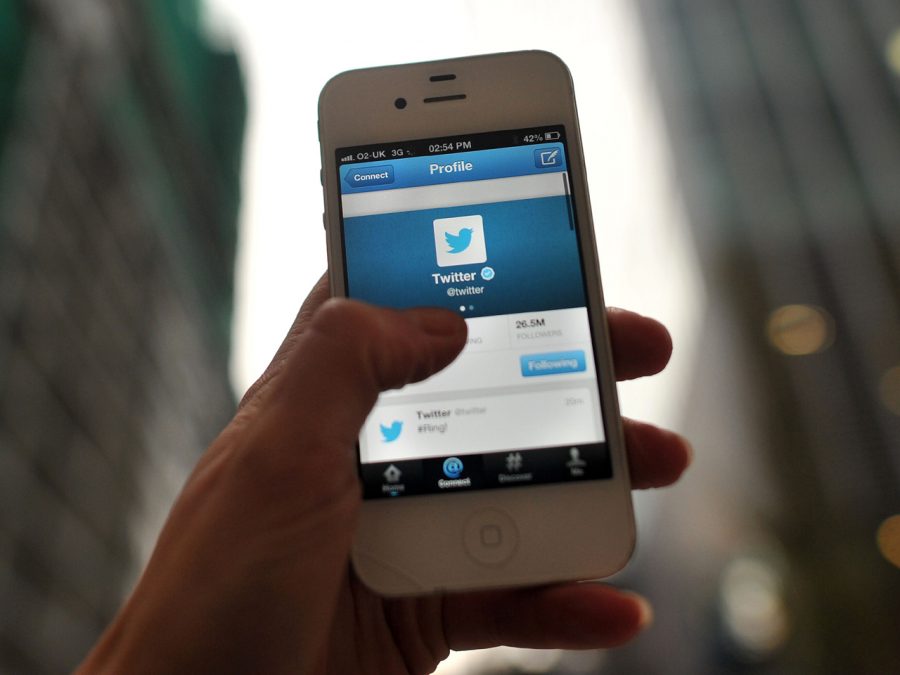  In this photo illustration, The Twitter logo is displayed on a mobile device.