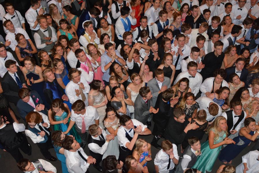 Students pause for the announcment of the prom royalty at the 2016 Prom held at the University of Utah Stadium. This years prom will have a much different look. Students will be required to space out during the dance to comply with state Covid-19 protocols.