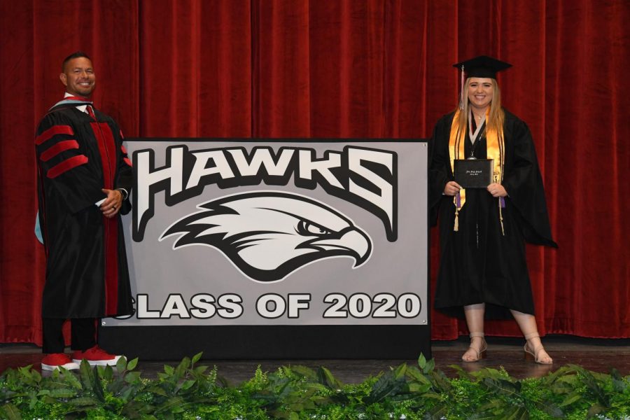 Miken McGill poses with her father Principal Brian McGill at the 2020 covid graduation walk through. The class of 2021 will pose at the Huntsman Center on the campus at the University of Utah.