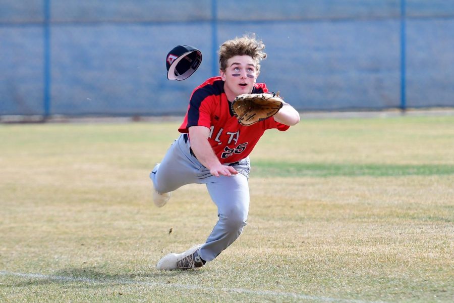 Colton Lingman makes a diving catch for an out on the opposing team.