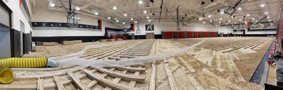 The gym remodel is going great, with newly painted school symbols and colors on the walls. The gym floor is curing so it won't warp once it's laid.