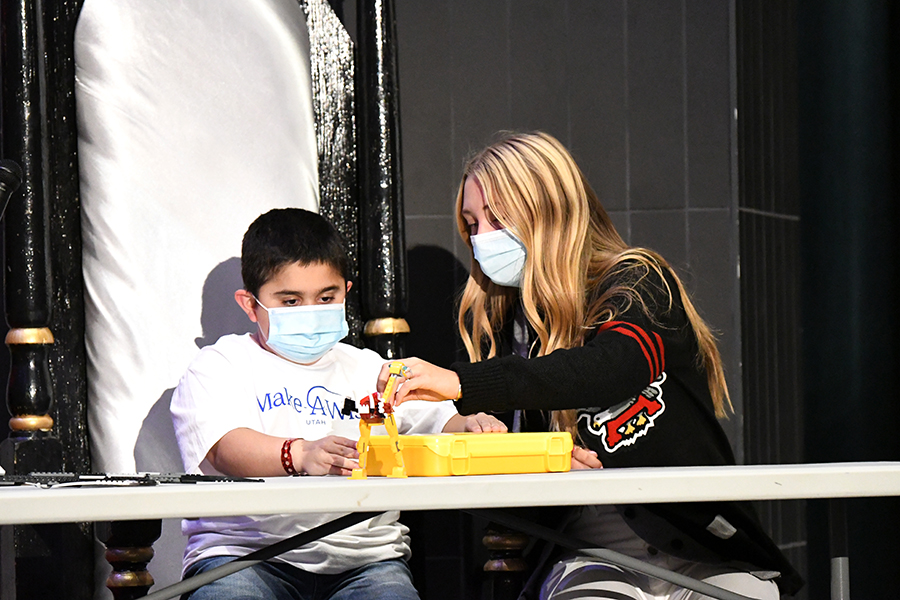 Marcus and SBO Financial Chair Rebecca Russell create with legos at last week's Make-a-Wish fundraiser assembly. Marcus's dream is to go to Disneyworld or go on a major shopping spree.