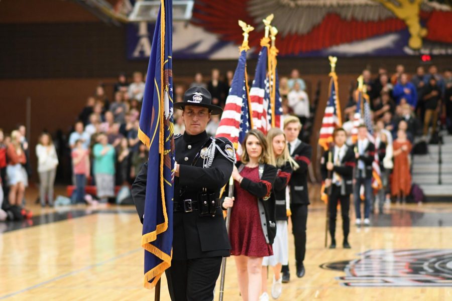 Student+Body+Officers+follow+Student+Resource+Officer+Shay+Ballard+as+they+present+the+colors+at+the+2019+Veterans+Assembly.+Last+years+assembly+didnt+happen+because+of+Covid+regulations.