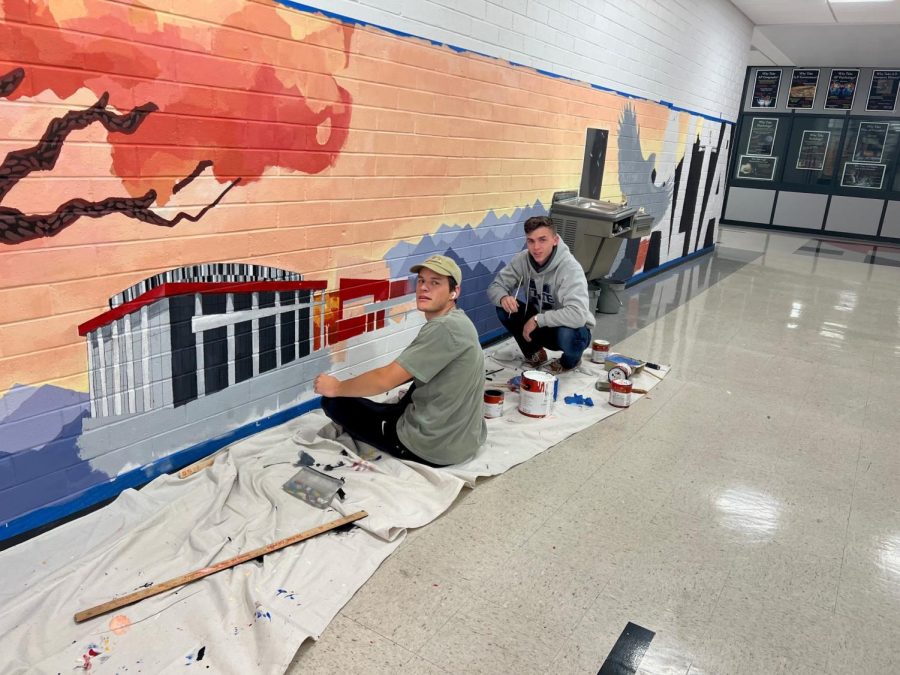 Ethan Thayne and Darby Hayes spent many hours creating the 2019 Alta legacy mural near the east side media center entrance; the mural is a gift from the class of 2019.