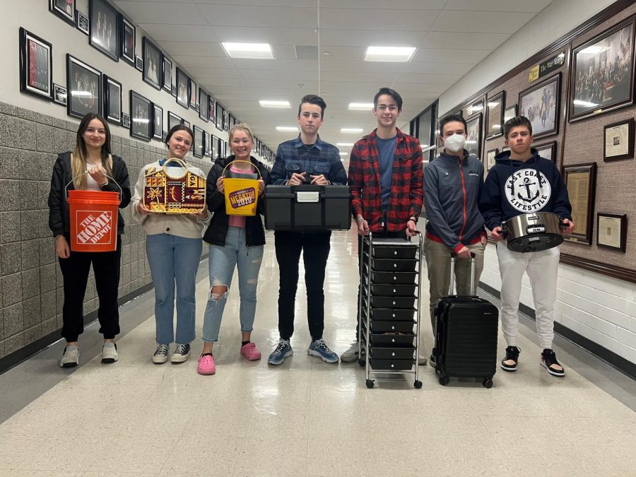 Some of Mrs. Ferguson's English students pose with their "Anything but a Backpack" containers at the beginning of 5th period on Friday. Administrators were forced to cancel the activity when some students brought large items that caused havoc in the school.