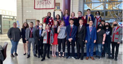 This years Debate Team poses at after their Region win at Jordan High School.