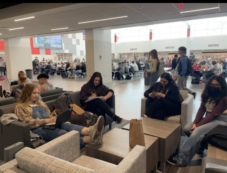 Jackie Aleman, Ava Semchuck, Ellie Klingmann, and Natalie Metcalf lounge on the new furniture off the commons.