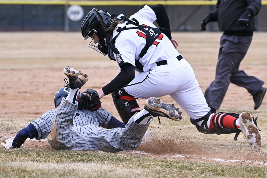 Catcher Colton Hall tags a runner out in a game last spring.