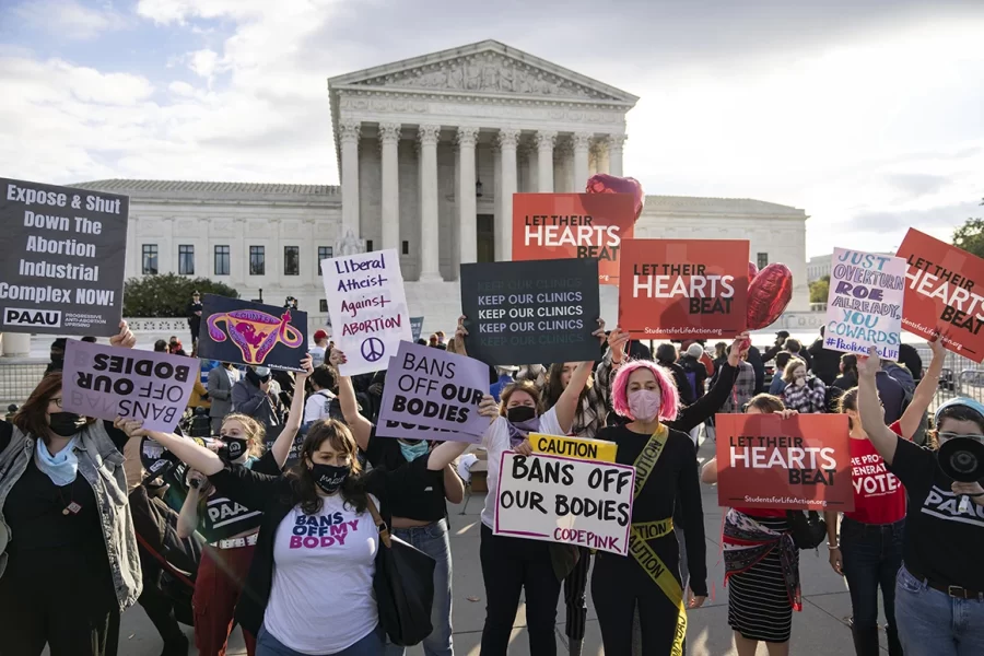 Abortion rights supporters and anti-abortion demonstrators rally outside the U.S. Supreme Court on Nov. 1, 2021. 