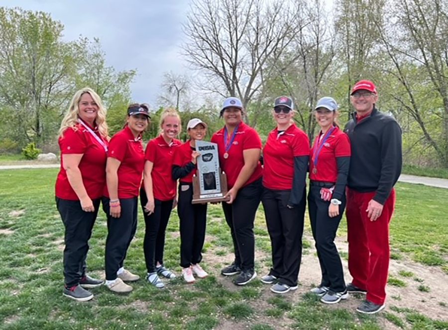 Last years Girls Golf team posses with their second place state trophy. 