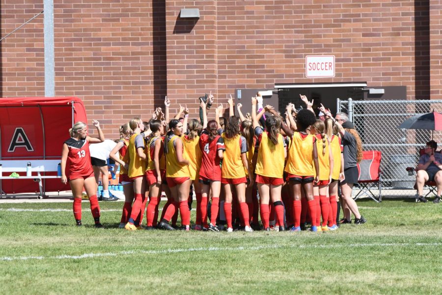 The+soccer+team+huddles+before+their+match+against+Lehi.+The+lady+hawks+beat+the+Pioneers+3-1.