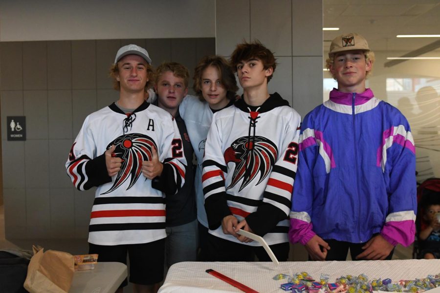 Members of the Hockey Club stand ready to provide information about joining their club at the last years club rush activity.