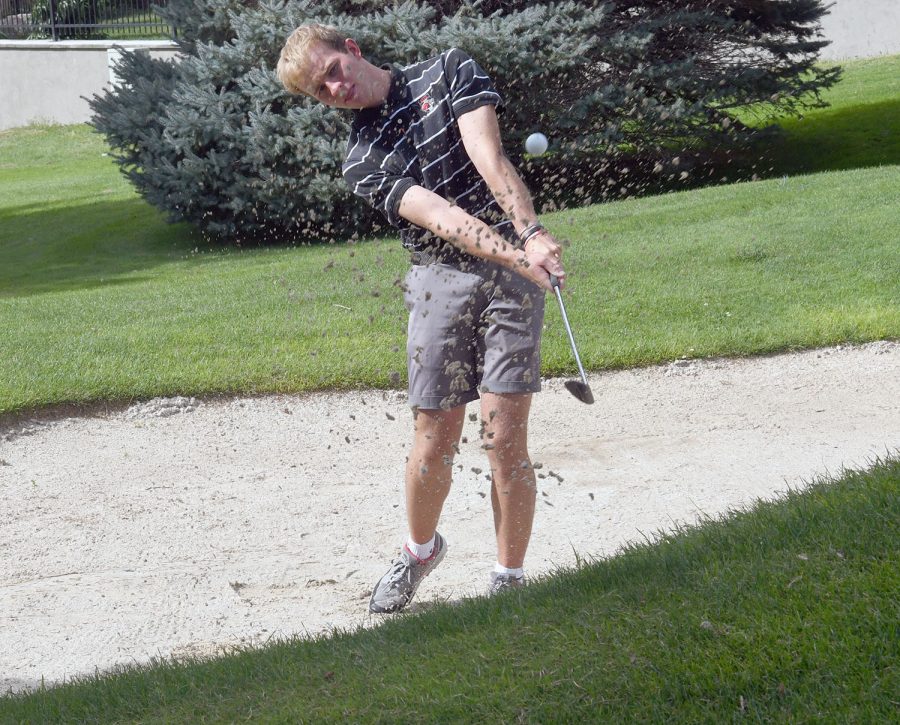 Ryan Richards shoots out of the sand to save par.