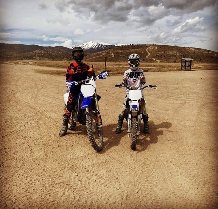 Gage Nichols and Brock Bennion ride dirt bikes in the dessert five mile pass. Its fun to go fast, Bennion says. We go early in the morning to get a jump on the day.