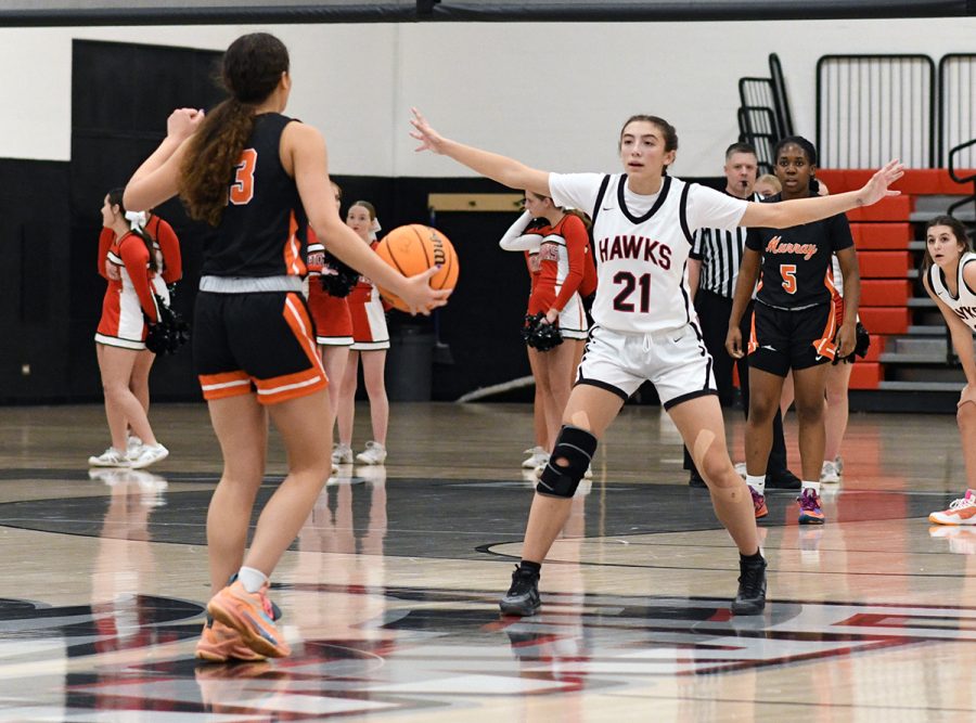 Point guard Brooklyn Larsen defends the hoop in their opening game against Murray. Larsen scored 9 points, 11 rebounds, and 5 assists.