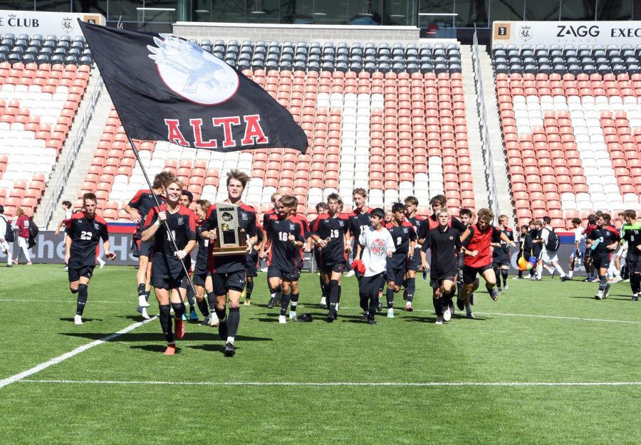 Following their 2022 championship game, the team parades with their hard earned trophy at the Rio Tinto field. The boys are working to repeat last years success.