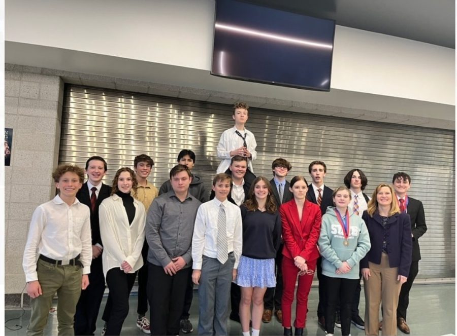 The debate team stand for a photo with their coach, Mrs. Croswhite. (far right)