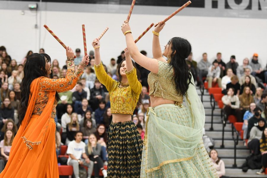Three students from the South Asian Students club perform a dance at the Diversity assembly.
