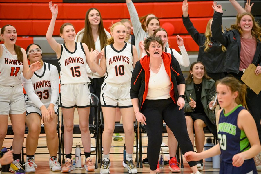 Coach Izzy Gustafson reacts to action on the court in one of this years womens basketball games.