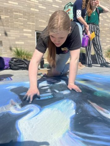 Alex Liljenquist enjoys some fresh air, sunlight, and time with friends during this years Chalk the Walk